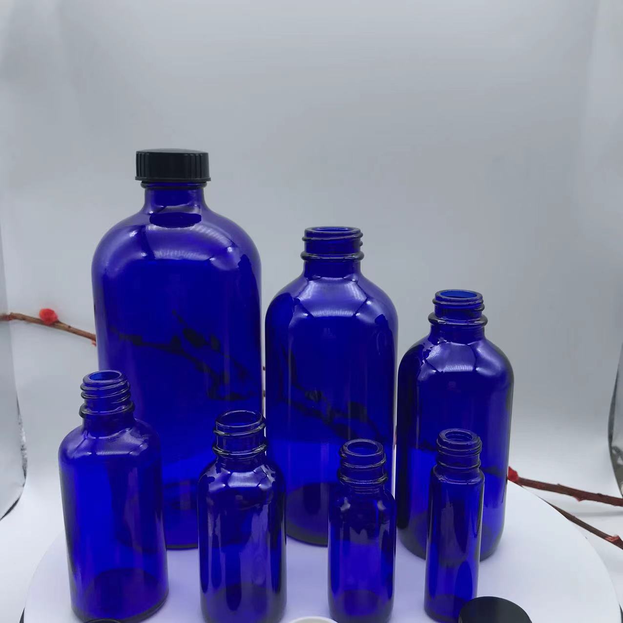 1 OZ Blue Boston Round Glass Bottle